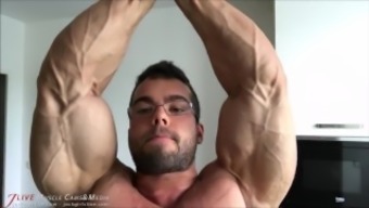 posing gay male flexible bodybuilder